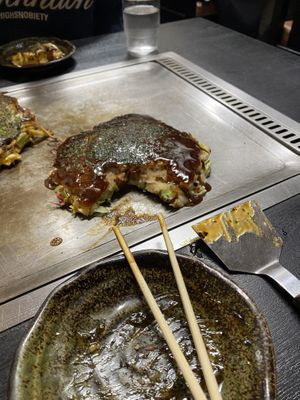 Vegan Okonomiyaki on the hot plate   at Okonomiyaki Chitose in Osaka