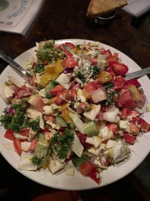 Israeali salad (comes with tahini and mustard dressing on the side)   at Little Buddha in Rishikesh