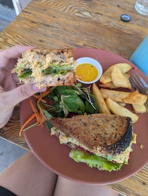 Smashed chickpea mayo toastie with side salad (already half eaten... sorry) and rosemary potato wedges at Blended in Cape Town