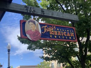 Sign outside with patio dinning  at Frida's Gourmet Mexican Cuisine in Anacortes