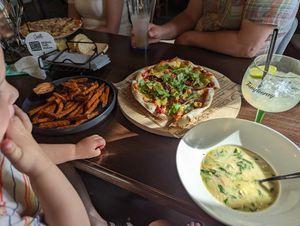 Fries, pizza, and Tom yum soup at Castello Pizzeria in Kuressaare