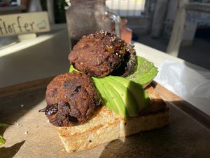 Avo toast with eggplant veggie balls  at Painapol in Holbox