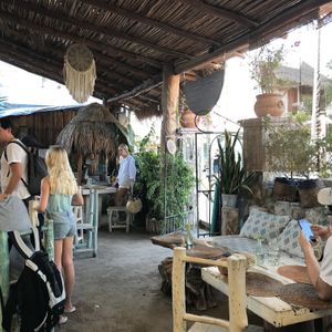 Seating area and street entrance at Painapol in Holbox