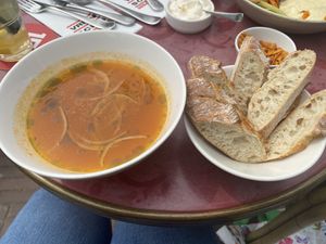 Clear minestrone soup with kapucijners (Dutch field peas), pomodori tomato and onion. Served with bread. at VRIENDSCHAP in Middelburg