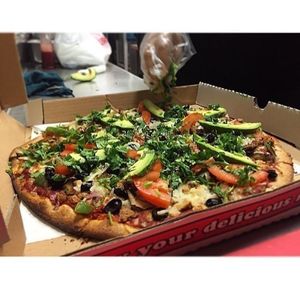 "Special pizza" whole wheat crust or gluten free rice crust with home made pizza sauce topped with 11 fresh toppings and choice of vegan or vegetarian cheese  at Leonor's Mexican Vegetarian Restaurant in Studio City