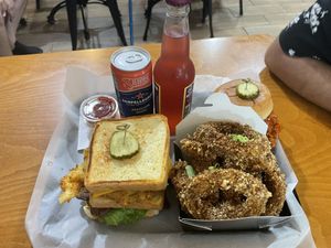 Fried green tomato sandwich, onion rings, buffalo chik’n sandwich (in the back)  at Bubbie's - Plant Burgers at Plant Food Lab in Washington