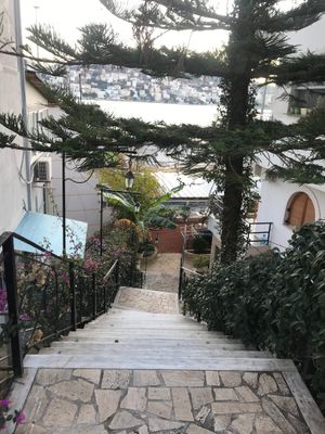 Stairs leading down to the restaurant at Onhezmi in Sarande