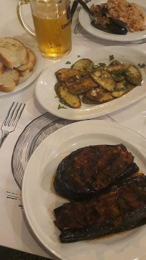 Stuffed eggplant + Fried zucchini w/garlic at Onhezmi in Sarande