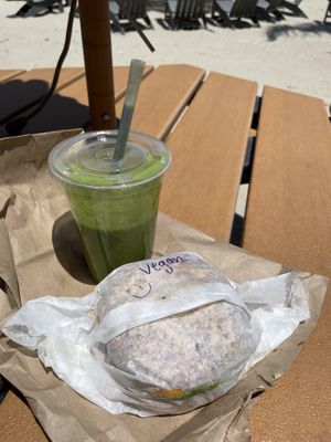 Vegan breakfast sandwich: everything bagel, egg, sausage, cheese, avocado (green smoothie from another shop)  at Shmagels Bagels in Ocean City