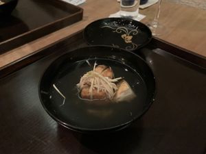 Mushroom soup, yuzu shreds, very yummy protein thing at Kajitsu in New York City