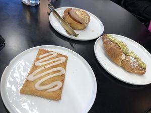 Apple pie pop tart, almond baileys cinnamon roll, pistachio croissant  at Canela in Calgary