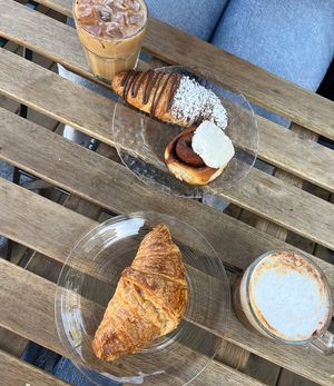 plain croissant, almond croissant and a free cinnamon roll!   at Canela in Calgary