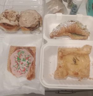 Cinnamon bun, feta danish, pistachio croissants, and raspberry pop tarts  at Canela in Calgary