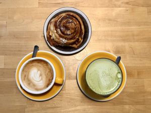 cinnamon bun, coffee and matcha  at Rohe in Tallinn