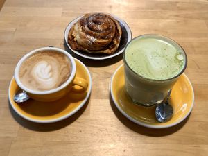 cinnamon bun, coffee and matcha  at Rohe in Tallinn