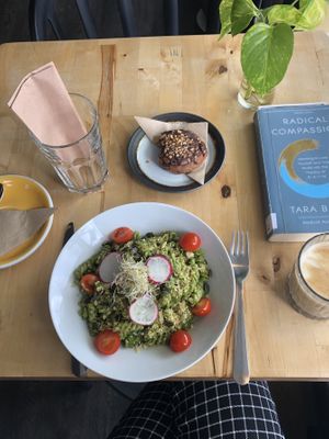 Pesto pasta, chocolate peanut cookie and an oat milk latte  at Rohe in Tallinn