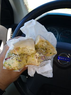 plain bagel with hommus, sprouts & onion at Pearl Street Bagels in Jackson