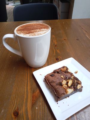 Chai Latte with oat milk & vegan brownie at Racoon Coffee & More in Alesund