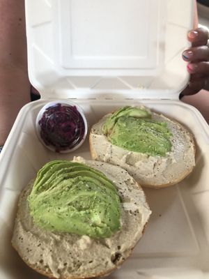 Avocado and cream cheese bagel ordered by my non vegan sister!  at Holi Vegan Kitchen in Miami