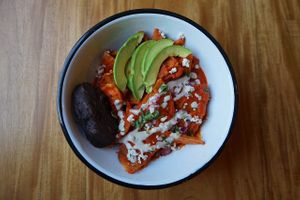 Chilaquiles with mushroom, avocado, beans  at Once:Once in Antigua