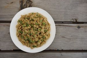 Cashew and zucchini Alfredo pasta with peas and cilantro.  at Once:Once in Antigua