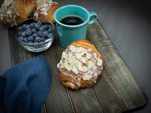 Our vegan croissant with a subtle yet sweet almond filling. Topped with a powdered sugar glaze and toasted almonds. at Metro Croissants in Parma