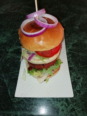 Double decker beyond burger with hot dog and salad at The Irish Viking in Lanzarote