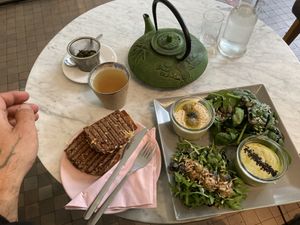 Breakfast w hummus and bread w „bacon“ & „cheese" at Miło bistro in Warsaw