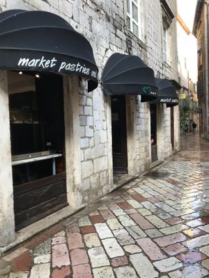 Side view of the bakery, with canopies. at Mamma Mia in Kotor
