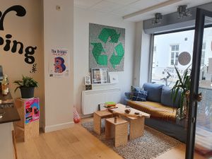 in the front there's a small seating area at KarmaMarkt in Bruges