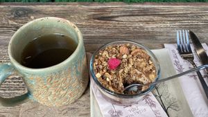 Cup of herbal tea and plum pudding   at Pijalnia Ziół in Warsaw