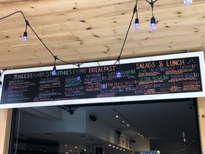 Menu. Juices, smoothies, breakfast wrap, burrito, salads, bowls, with vegan cheese, vegan sour cream, vegan Cesar. Great options. Super friendly staff at Live Cafe in Kennebunk