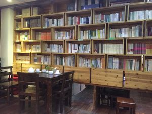 Books for sale along the outside room partition. at Ji Xiang Cao - Lucky Zen & Veg Restaurant in Shanghai