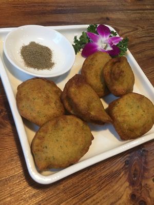 Fried zucchini pancakes with mushroom inside. at Ji Xiang Cao - Lucky Zen & Veg Restaurant in Shanghai