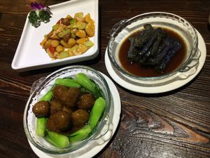Clockwise from top left: cashew stir fry, eggplant, and vege balls with bok choy at Ji Xiang Cao - Lucky Zen & Veg Restaurant in Shanghai