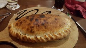 CALZONE VEGETARIAN CHILLI (VEGAN) - Italian beans and med veg in spicy chilli sauce, filled and baked in pizza dough at Palominos in Erskine