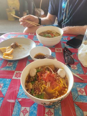 fresh egg noodles with tomato-eggplant broth and mushroom balls at Kao Man Kai Jay Vegan in Chiang Dao