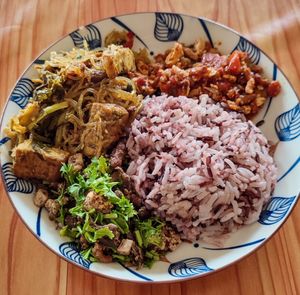 Red rice with 3 sides. B70 at Kao Man Kai Jay Vegan in Chiang Dao