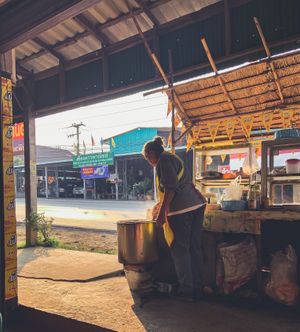 Friendly lady cooking the noodle soup  at Kao Man Kai Jay Vegan in Chiang Dao