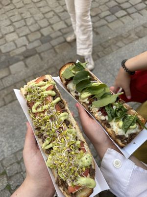 On the left is vegan with tofu and sprouts, right is vegetarian with sundried tomatoes and cheese.  at Długa Buła in Torun