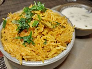 Thakkali Saadham
A flavorful rice dish made with fresh tomato, spices and rice. In the Tamil language, ‘thakkali‘ means tomato and ‘saadham‘ is rice. at Podi & Poriyal in Central Singapore