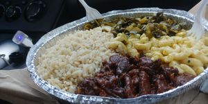Large brown rice, pepper steak, mac n cheese, collards - $15 at Belmont Vegetarian Restaurant in Worcester