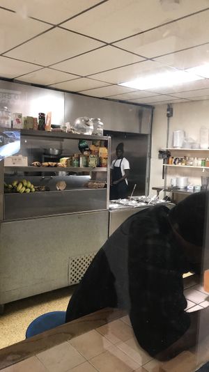 People working hard in the back making all the food from scratch! at Belmont Vegetarian Restaurant in Worcester