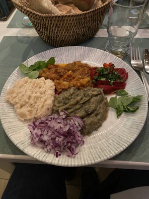 Plates of different vegan dishes at La Liman in Tulcea