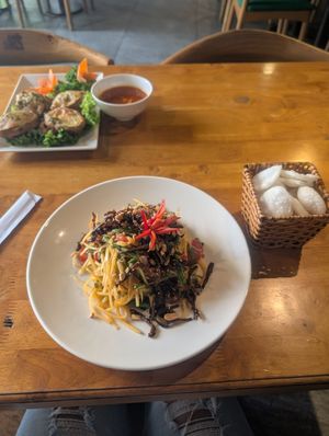 Papaya salad with prawn crackers and fried aubergine with ginger and chilli yum! at Sen Vegan House in Ho Chi Minh City