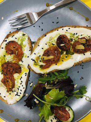 Toast with nuts cream cheese, pesto and tomates  at Soul - Alimentação Saudável e do Bem in Braga