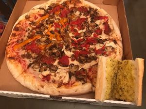Vegan cheese pizza with vegan sausage, vegan chicken, peppers, mushrooms, extra sauce; garlic bread with Vegan butter  at Giovanni's in Pittsburgh