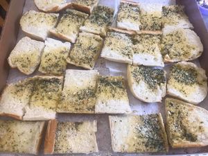 Their garlic bread is always vegan, made with vegan margarine  at Giovanni's in Pittsburgh