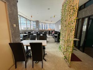 Tables and chairs at Minf Houze Vegan Cafe in Kuala Lumpur