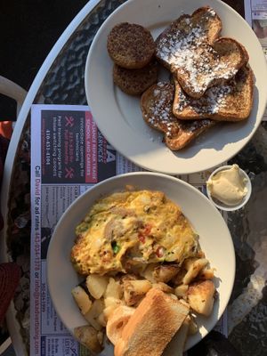 Veggie omelette with home fries and toast (and vegan butter) and french toast with sausage  at Speedway Cafe in Dover